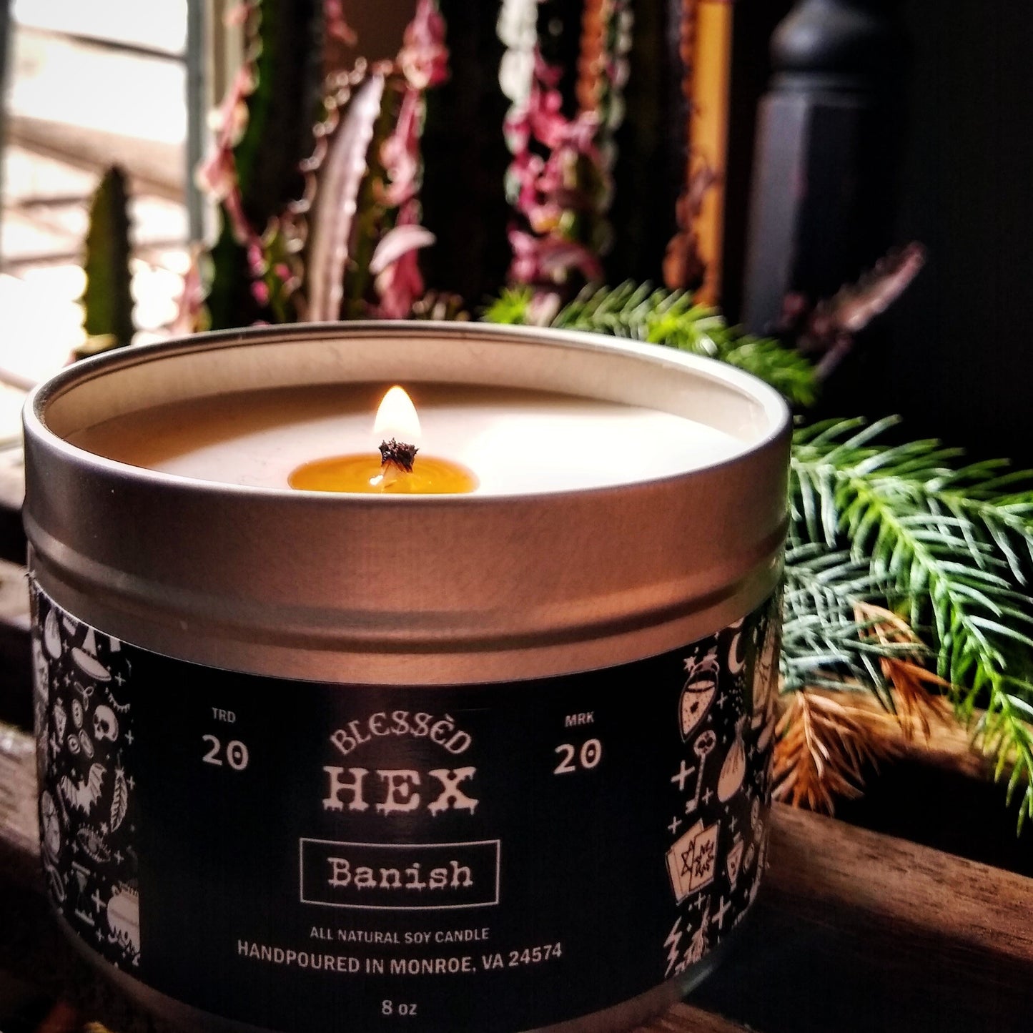 Banish luxury soy candle in a recyclable tin, a sage and pinon pine metaphysical banishing fragrance from Blessèd Hex