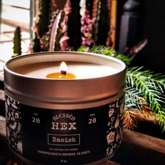 Banish luxury soy candle in a recyclable tin, a sage and pinon pine metaphysical banishing fragrance from Blessèd Hex