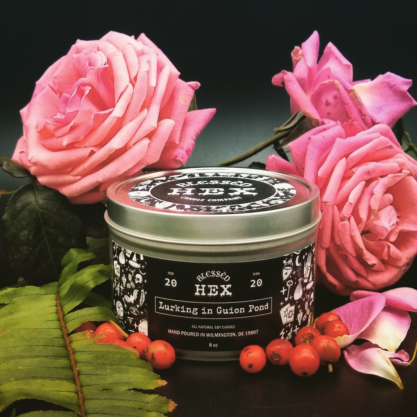 Lurking in Guion Pond luxury soy candle in a recyclable tin, a rose and red currant folk horror fragrance from Blessèd Hex
