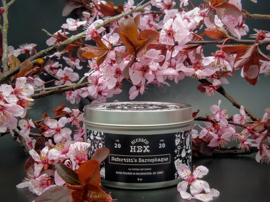 Nefertiti's Sarcophagus luxury soy candle in a recyclable tin, an Egyptian musk and blue lotus fragrance from Blessèd Hex
