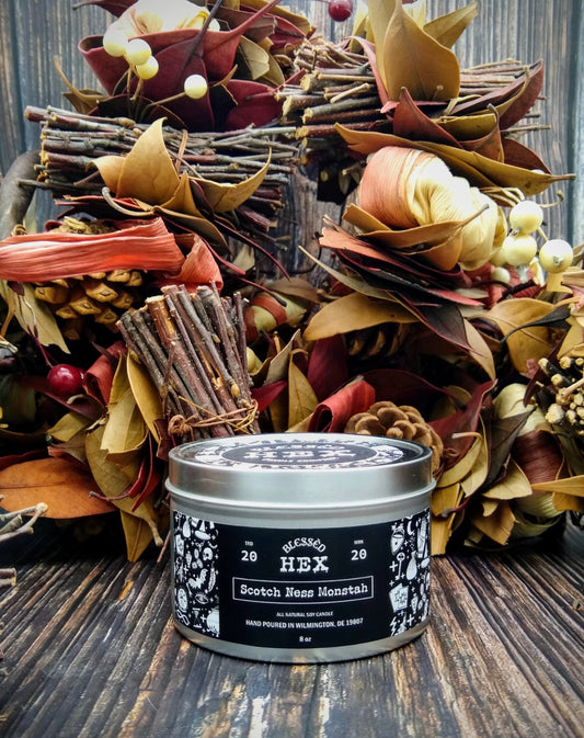 Scotch Ness Monstah limited-edition luxury soy candle in a recyclable tin, a scotch and honey cryptid fragrance from Blessèd Hex